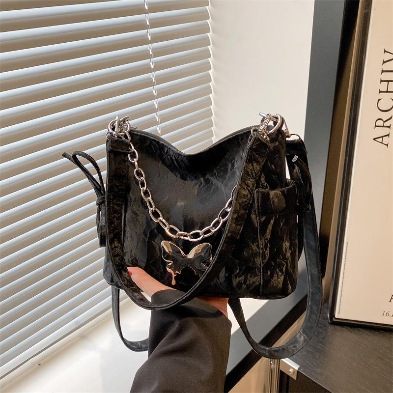 Korean version of fashion butterfly chain messenger bag women's 2025 summer new versatile hand carry shoulder armpit bag tide