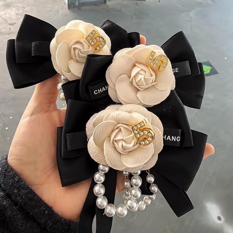 Modern Pearl Floral Pin With Butterfly Knot Design For Adult Formal Wear
