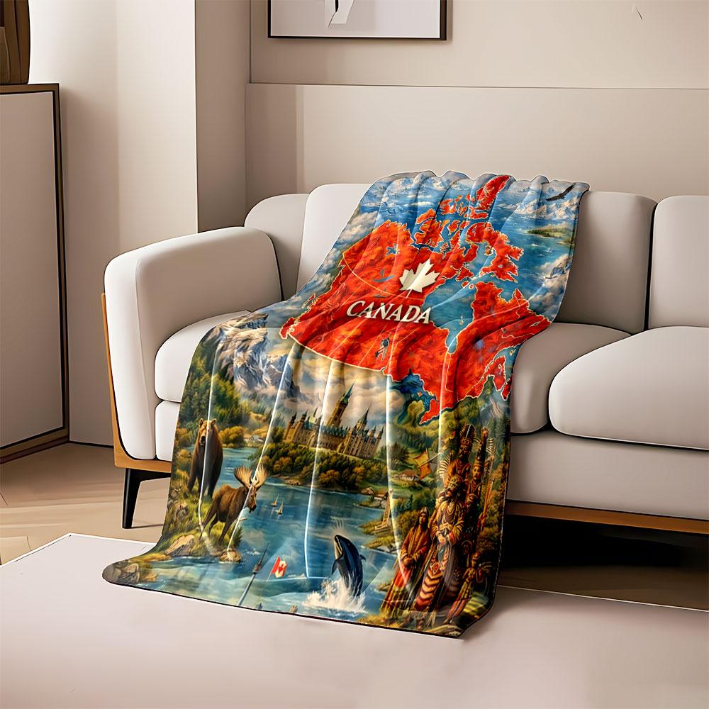 

A red map of Canada with a white maple leaf, surrounded by nature imagery. for all seasons blanket lunch break throw gift 80cm x 120cm