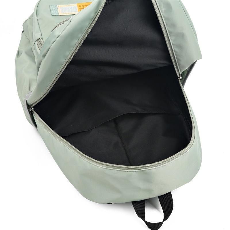 New female junior high school student schoolbag simple and versatile large-capacity backpack fashionable travel backpack