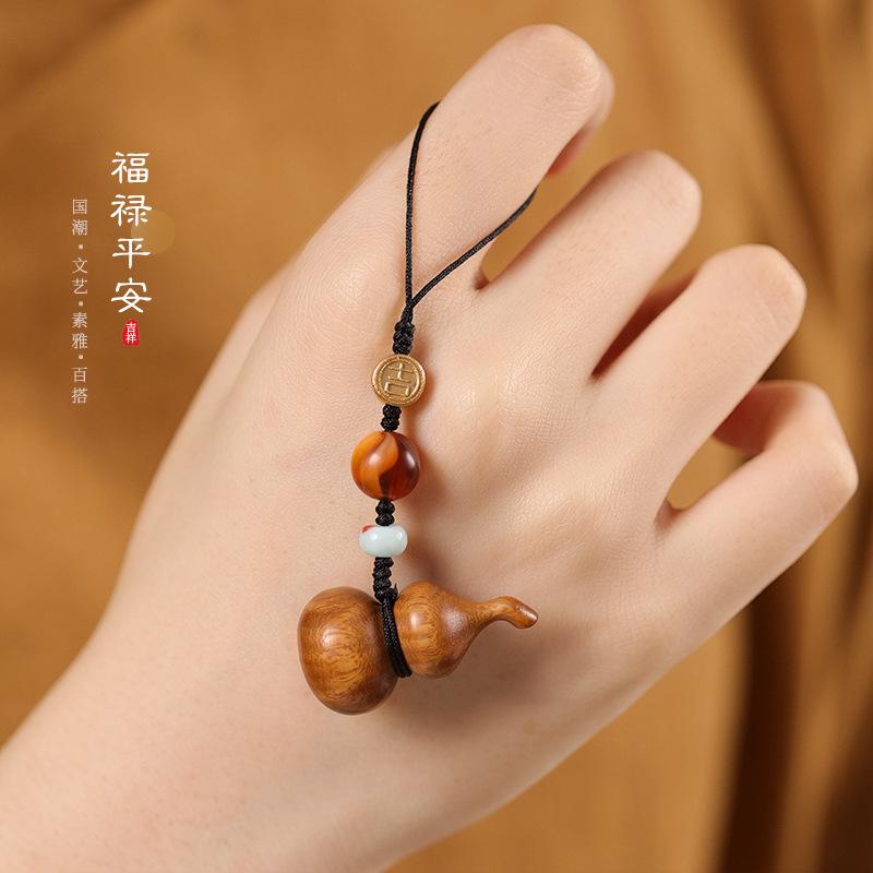 Creative Chinese-style high-end sandalwood small gourd phone chain pendant U Pendant for hanging on a bag, suitable for couples