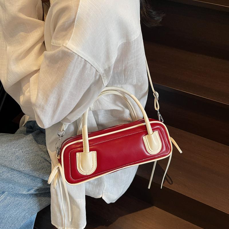 Korean version of fashionable textured portable bowling bag women's 2025 new trend versatile contrasting color baguette underarm women's bag