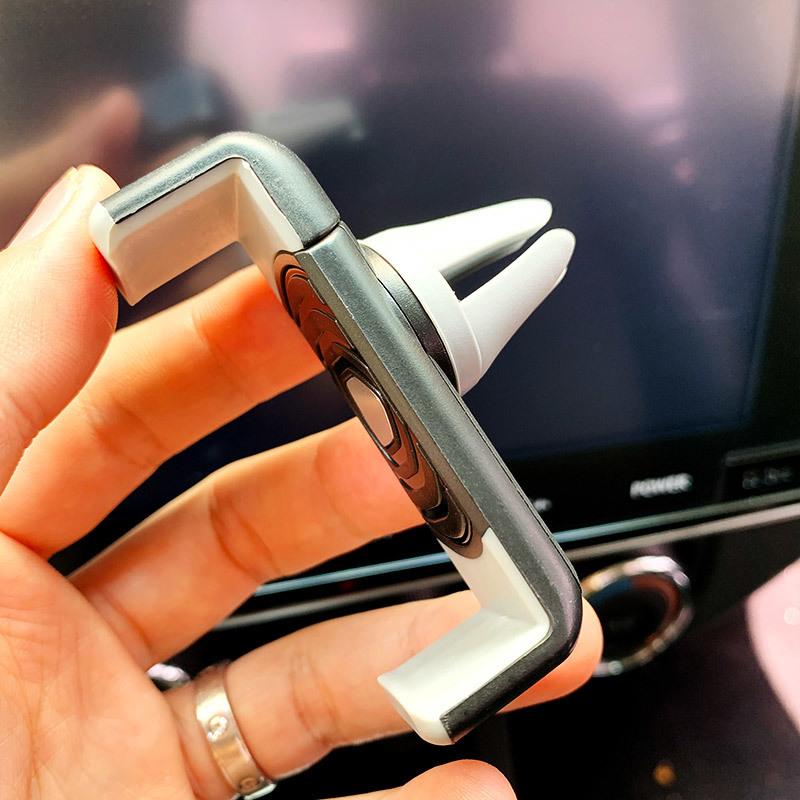 

Mobile phone car bracket is simple and universal trend car special navigation mini telescopic buckle car bracket factory