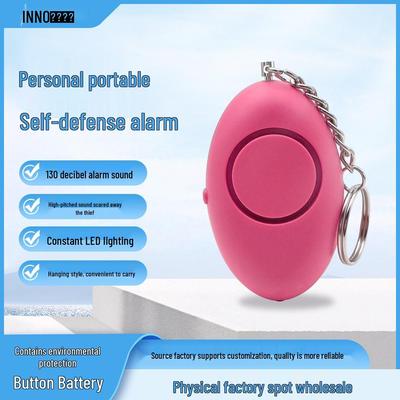 Oval Personal Alarm Keychain: Safety Self-Defense Device with LED Light for Women, Outdoor Use, and Wolf Repellent.
