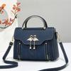 The Lady Is Carrying A Sweet Single-shoulder Bag with A Large Capacity for Daily Commuting, A Crossbody Bag.