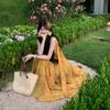French seaside vacation atmosphere yellow smudged floral V-neck dress women's suspender photo dress summer