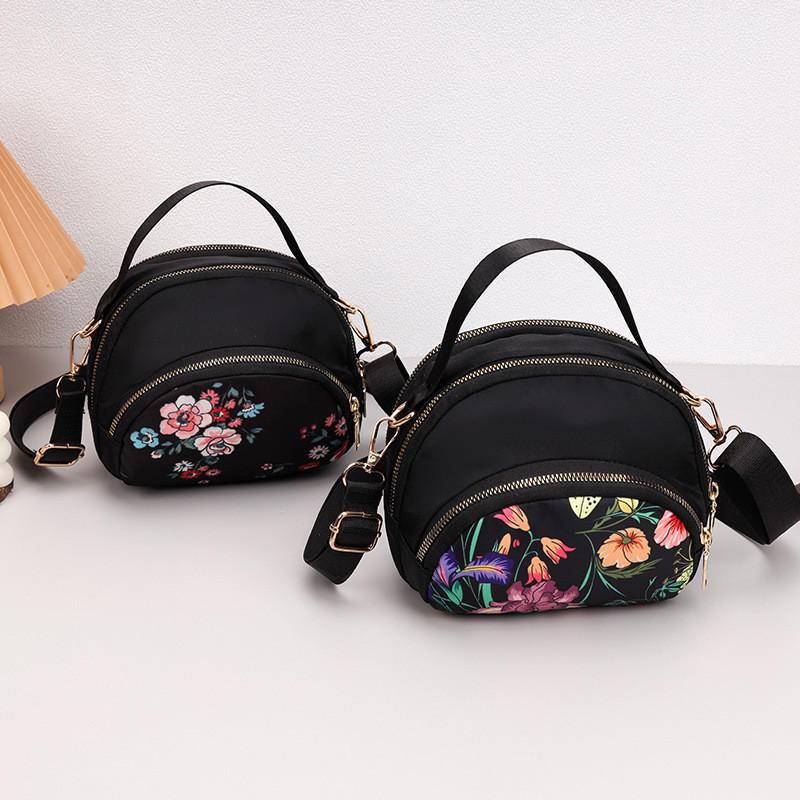 Borsa a tracolla rotonda piccola in tessuto Oxford con tasca con cerniera per uso quotidiano