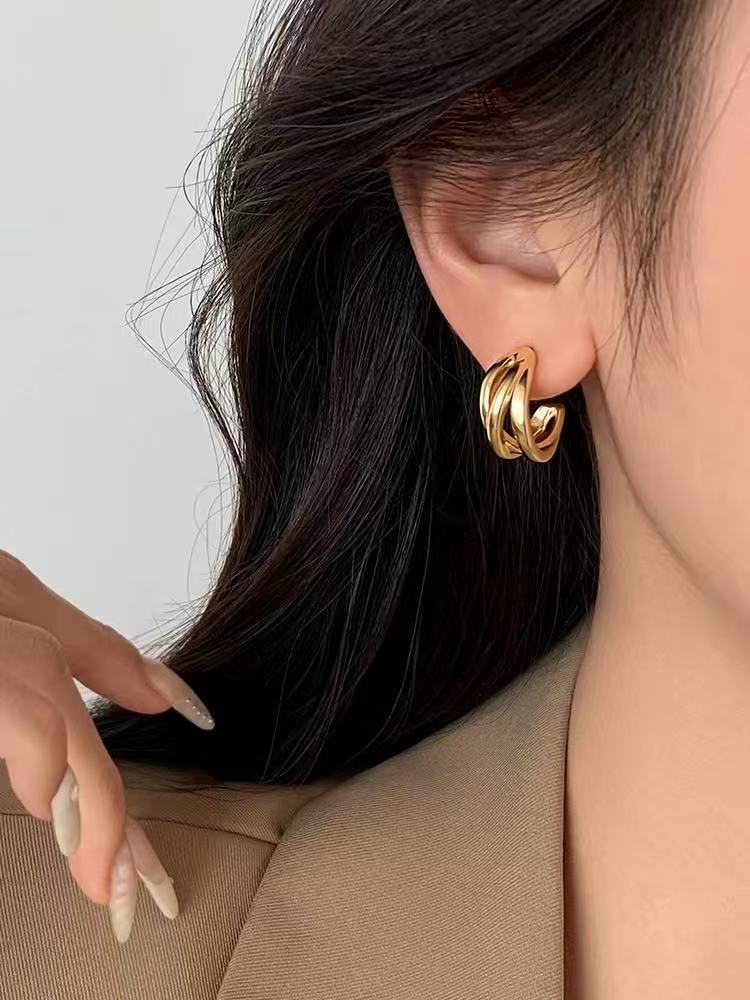 925 sterling silver needle metal winding stud earrings niche design earrings 2026 new explosion light luxury earrings