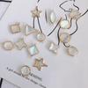 DIY juvelierizstrādājumu amatniecības piederumi: Fantasy Caurspīdīgs Shell Star ģeometriskās jostas piekaramie auskari un kaklarotas materiāli