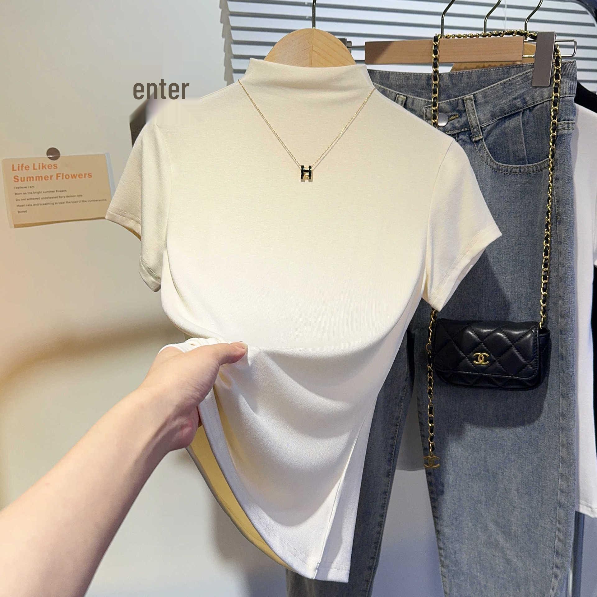 

Женская модная черная футболка на лето 2024: Ребристый полувысокий воротник, короткий рукав, стандартная линия плеча Small абрикосовый