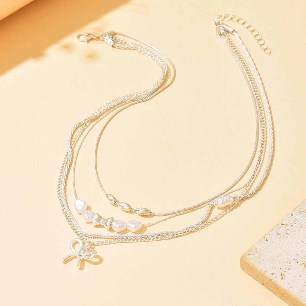 Wear Bow Collarbone Chain Wholesale European and American Multi-layer Stacked Accessories Niche Imitation Pearl Light Luxury High-end Necklace