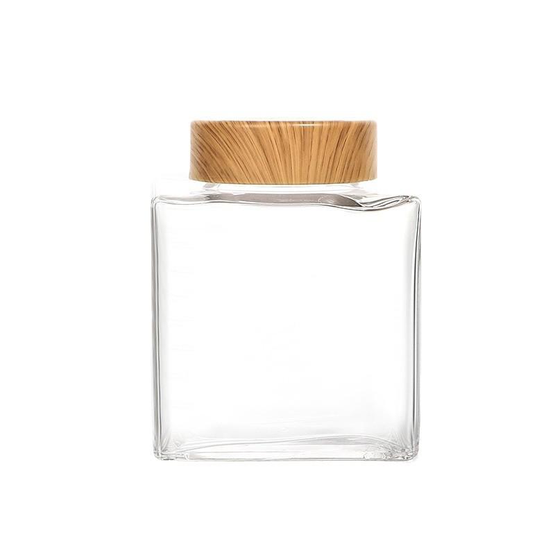 Verdickte flache quadratische Glasflasche mit Holzmaserung für Honig oder Marmelade