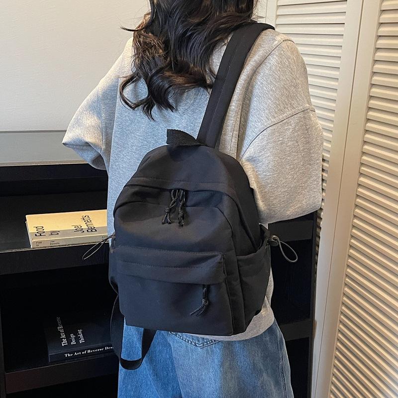 Minimalist Backpack for Women and Men Lightweight Nylon School Bag with Front Pocket
