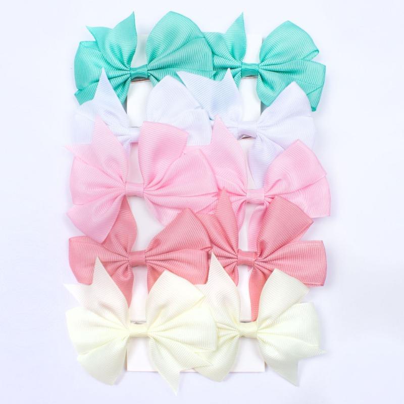 

Stylish new children s hairpin set, solid color ribbed dovetail ribbon V-bow baby hairpin.