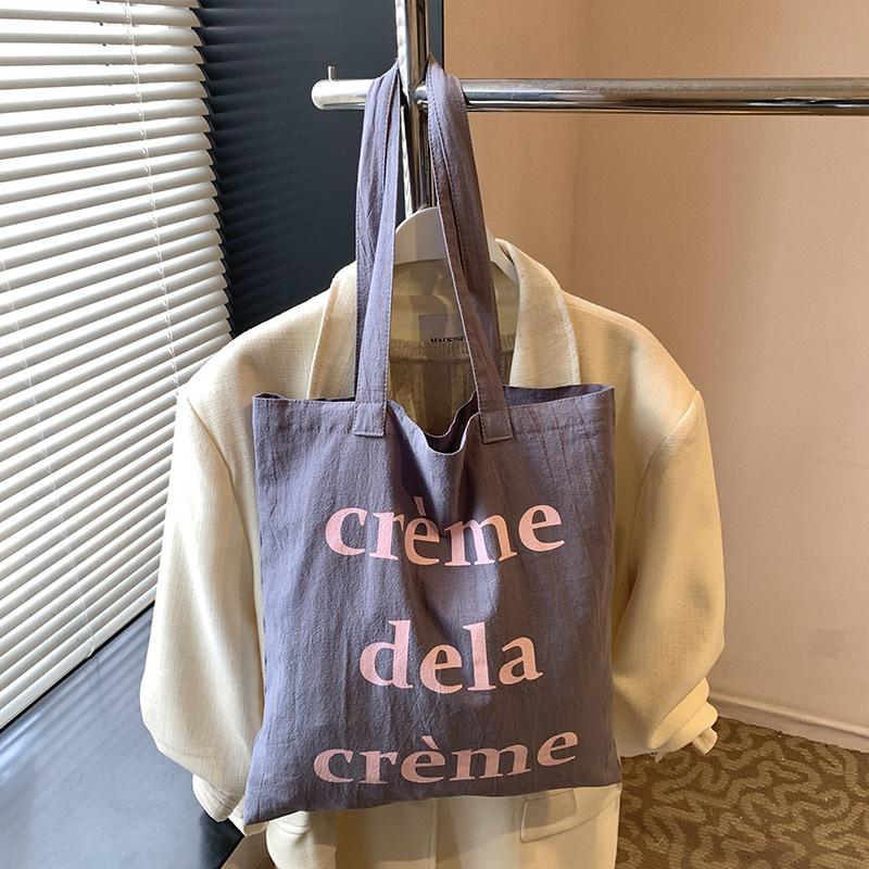 

Korean versatile canvas bag 2025 new large-capacity commuter canvas bag summer candy color small fresh shoulder bag 37.5*0.5*41 серый