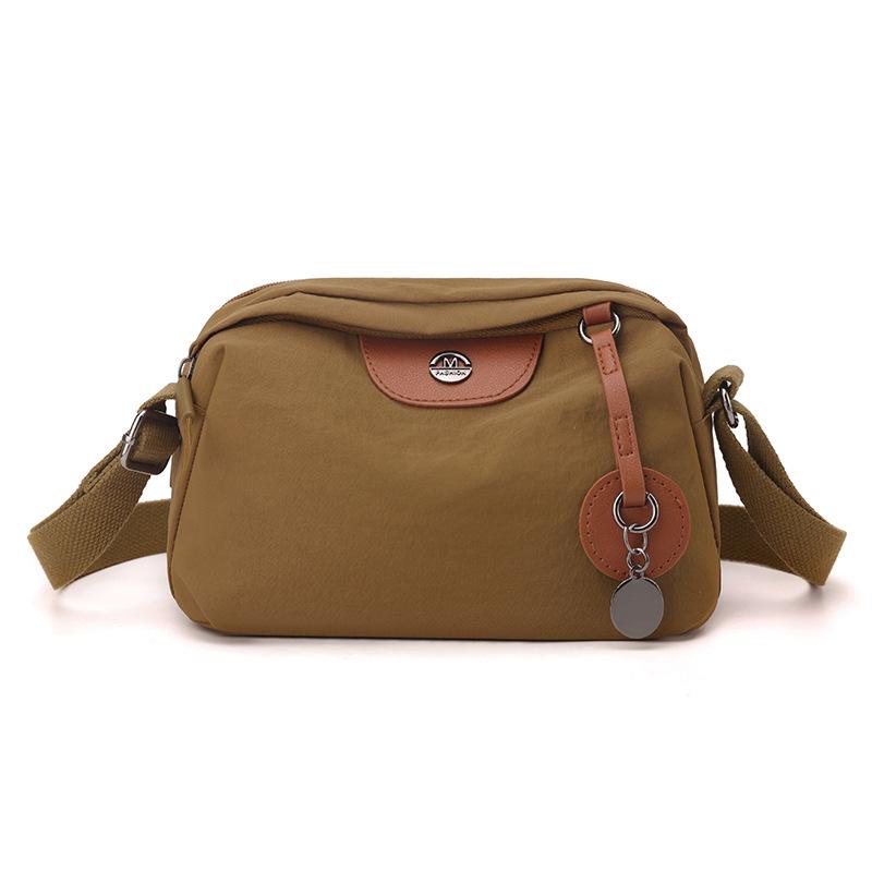 

Lightweight women s shoulder bag, stylish and simple versatile messenger bag, large-capacity anti-splashing nylon bag.