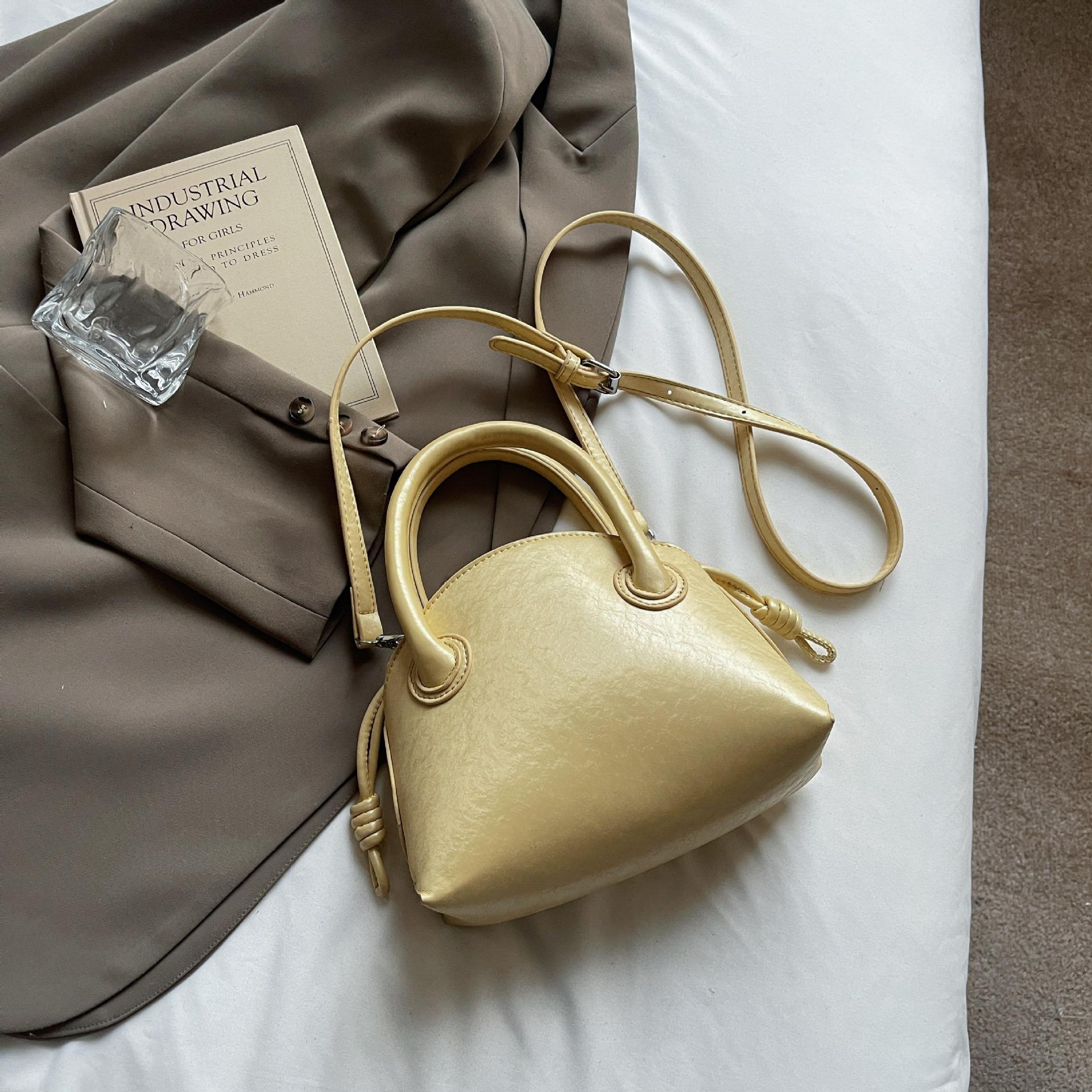 

Bag women s niche versatile mother and child bag handbag winter new high-end ins wind single shoulder armpit messenger bag жёлтый