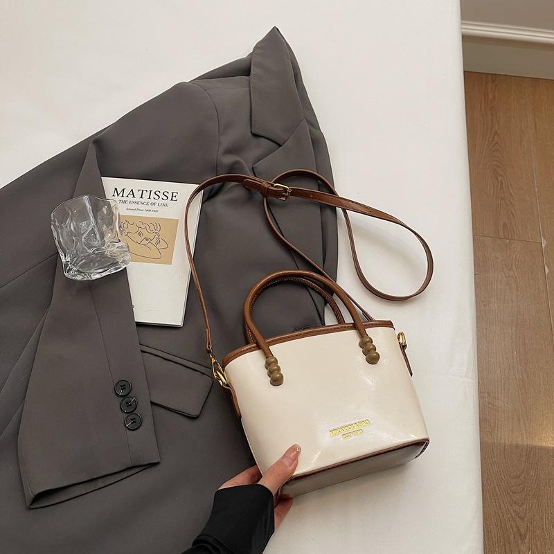 

High-end contrasting color portable bucket bag women s new spring and summer fashion messenger bag commuter small bag