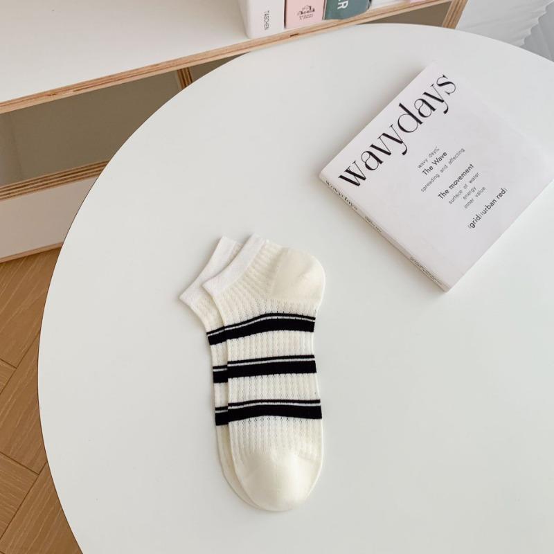 A Woman Wearing Summer Mesh Black and White Simple Embroidered Lettering Ultra-thin and Breathable Short Socks