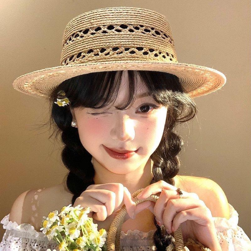 New hollow flat top Lafite straw hat women's summer new seaside beach sun hat French elegant straw top hat