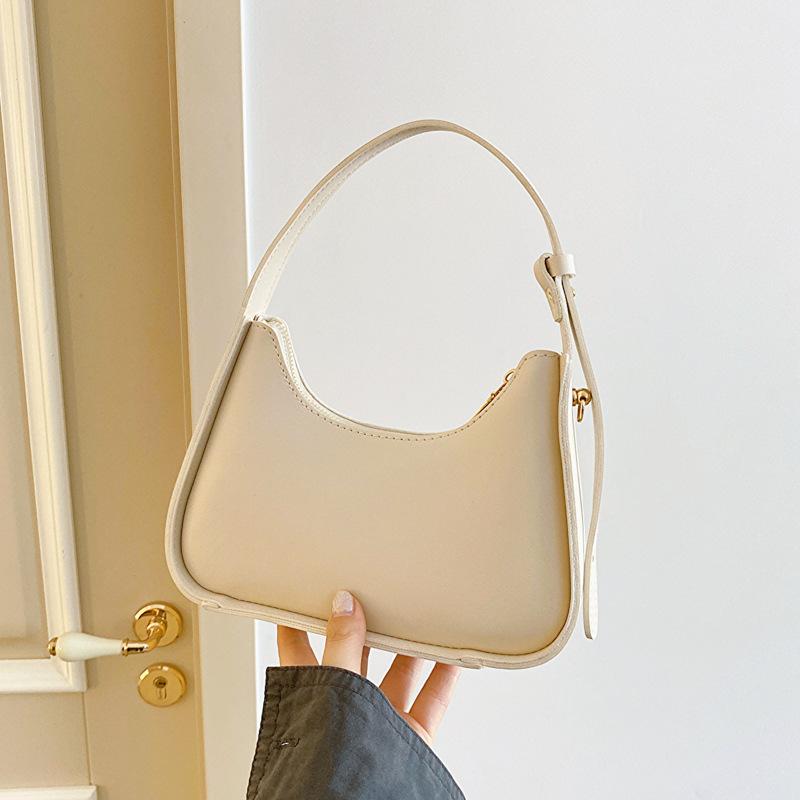 

Премиальная текстура нишевой сумки для женщин 2024 года, новая летняя универсальная сумка этого года, популярная французская белая сумка через плечо подмышкой белый