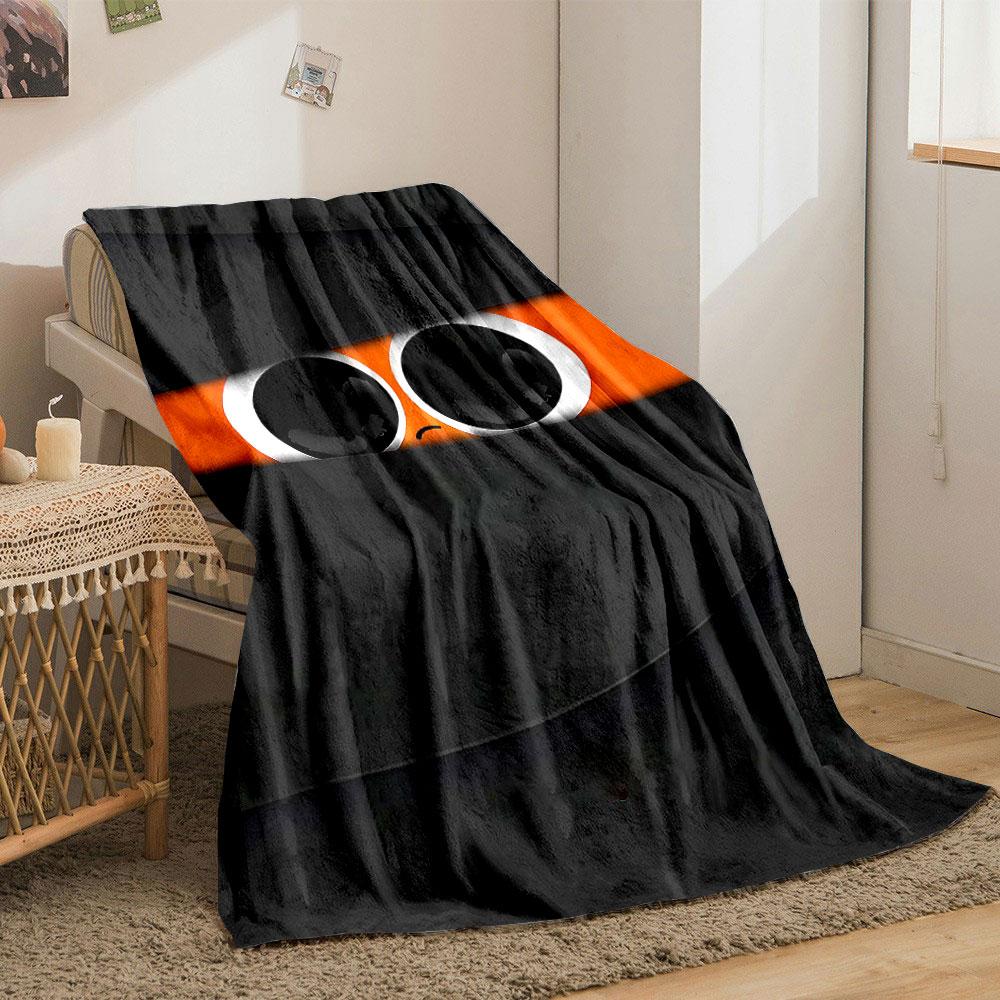 Large eyes with a sad expression peek through black horizontal slits. for all seasons blanket lunch break throw gift
