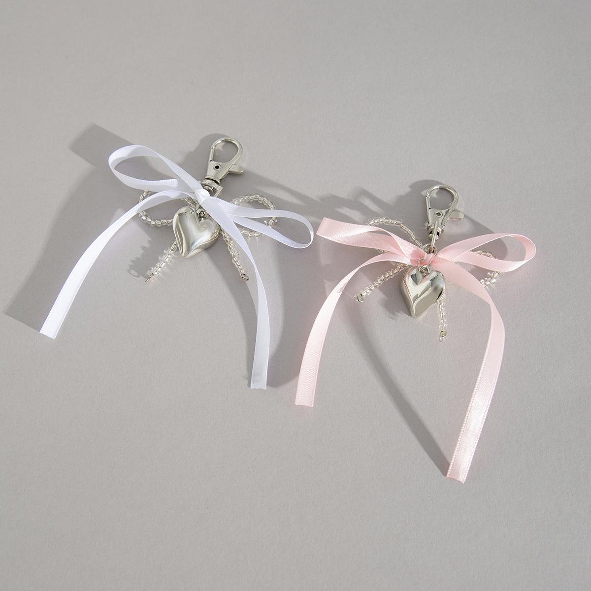 

Свежий ремешок-бантик, простая цепочка с подвеской-мешком для ветра, геометрический брелок с бахромой в форме сердца для женщин