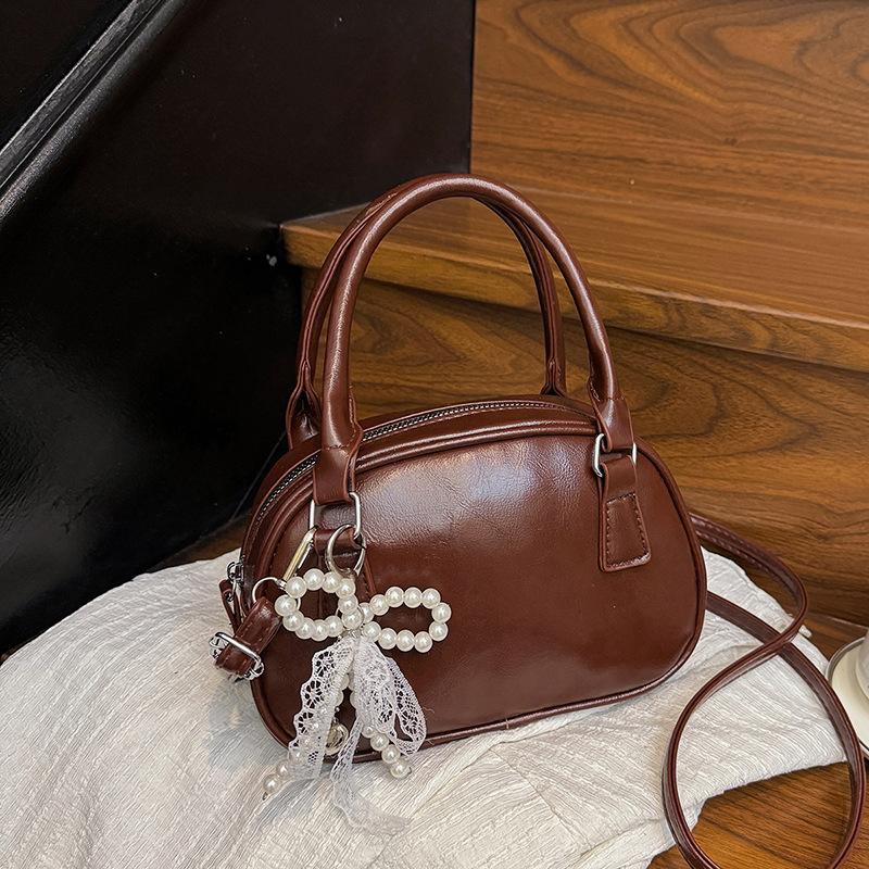 Neue Nischendesign modische Textur Handtasche Bowlingtasche Damen vielseitige Schulter Umhängetasche