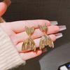 Metal cold wind pleated fishtail shape earrings European and American personalized design earrings simple niche temperament earrings