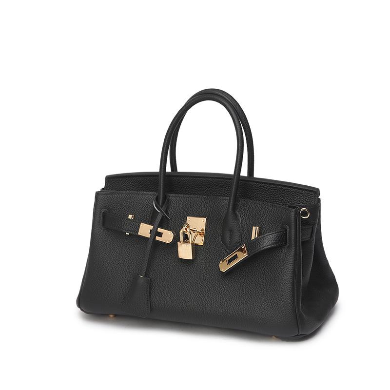 Кожаная ручка Шоколад Того Верхний слой коровьей кожи Горизонтальная металлическая сумка Натуральная кожа Женская сумка Замок-пряжка Высококлассное ощущение Удобная сумочка 30x12x16cm чёрный