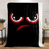 Red and white angry eyes with an arched red frown on a black background. for all seasons blanket lunch break throw gift