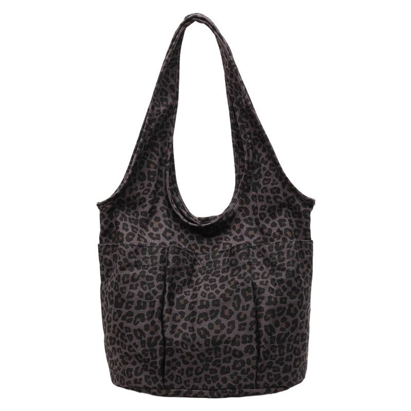 This season, Korean ins style leopard print canvas bag casual large capacity commuter women's shoulder underarm triangle tote bag