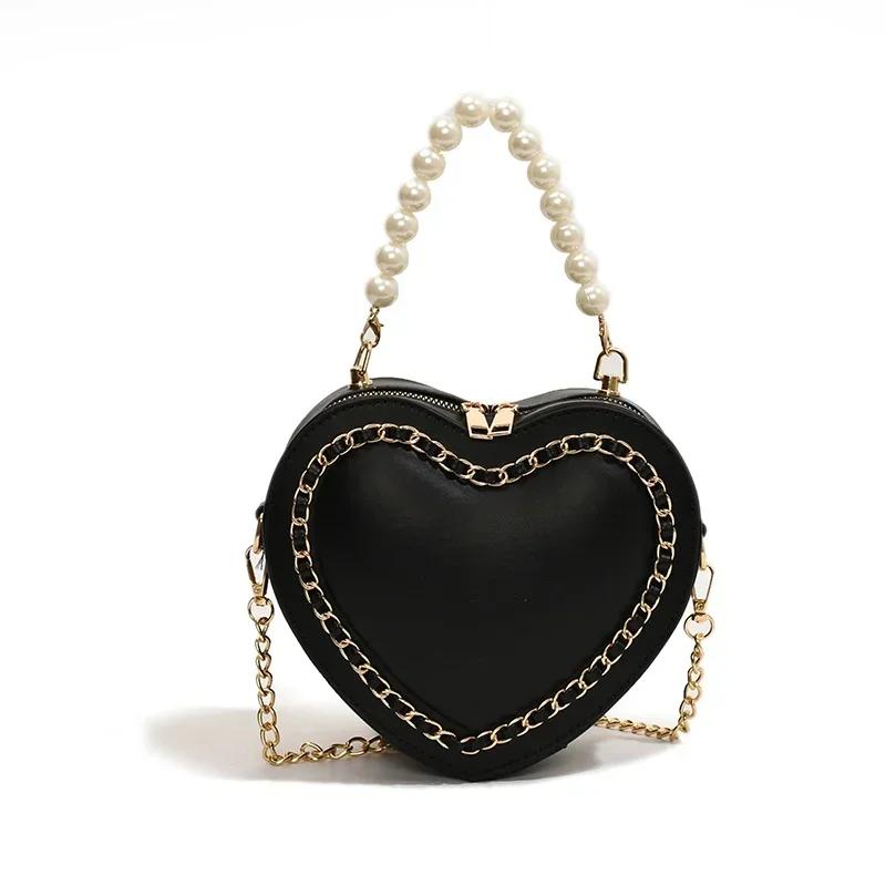 Meistverkaufte exquisite einzelne Schultertasche für Damen, neue herzförmige Perlenschuhtasche mit hoher Textur, Braut-Rotkettentasche