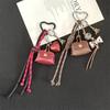 Piccola Borsa in Pelle Stile Miu con Portachiavi Fascino Fiocco Torre Eiffel