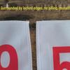 Red Running Marathon Race Bib with Black Number Plate