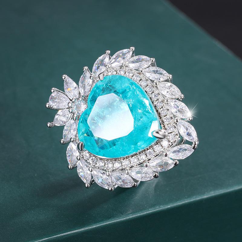 

Ювелирные изделия Медное основание с золотым покрытием Имитация Параибы Сердце Подвеска Кольцо Набор Основной камень 15 * 15