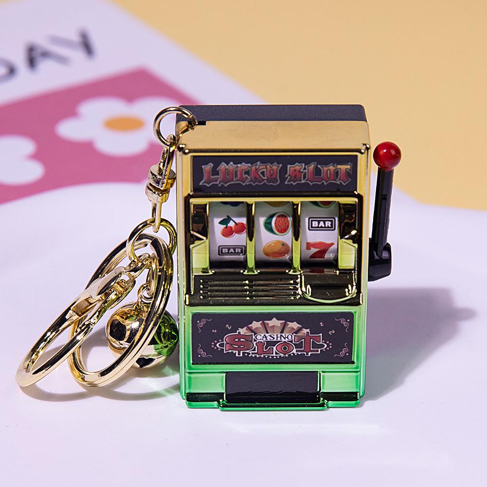 Gold-Plated Creative Tiger Fruit Machine Keychain Toy with Lottery Play Feature