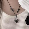 Vintage Achromatic Knotted Glass Heart Necklace