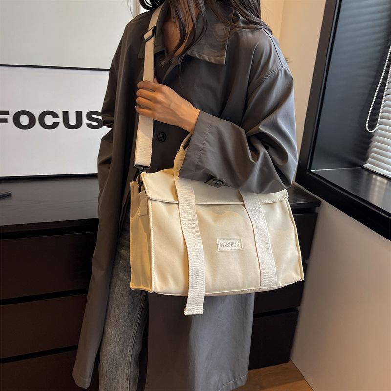 Light handbag bag women's new 2025 popular large-capacity messenger canvas bag shoulder commuter tote bag