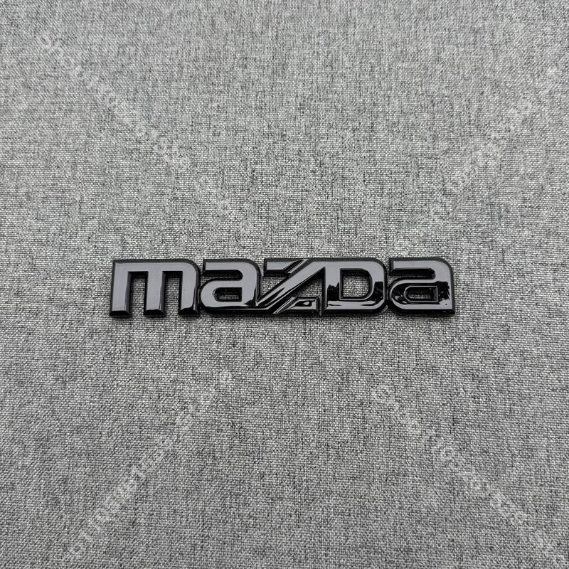 ABS Car Logo Front Grille Rear Trunk Steering Wheel Decoration Sticker For MAZDA2 2009- 2011-2015 16 17-2025 2026 MAZDA2 Emblem BBF3