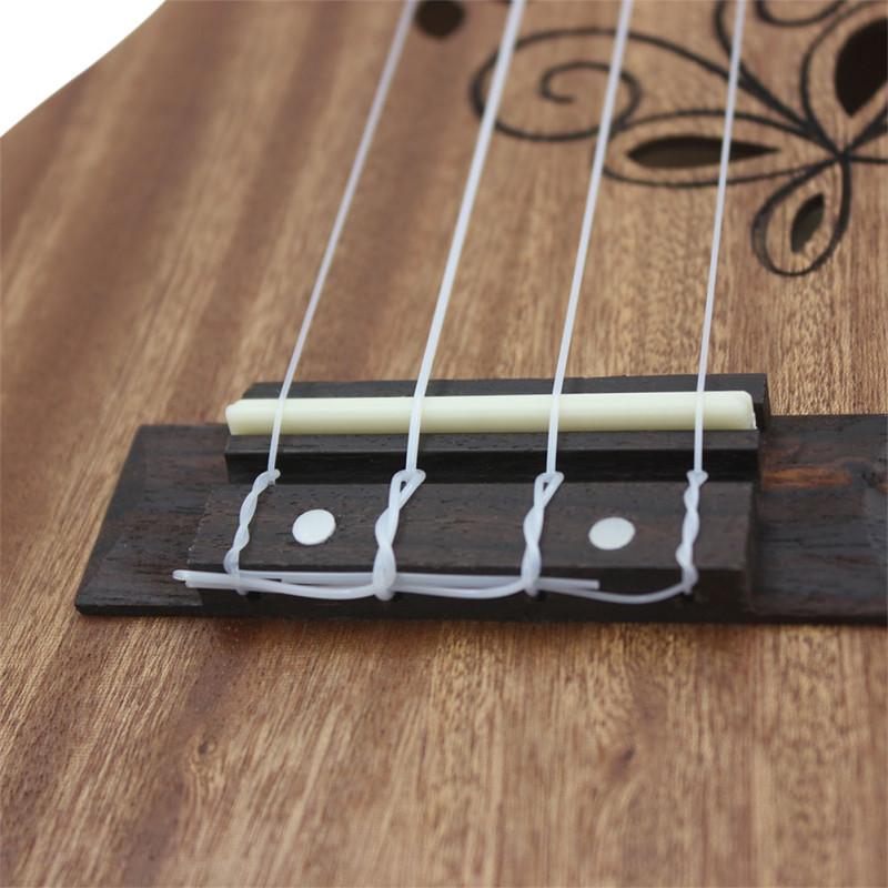 21-Zoll-Sapeli-Ukulele, hohl geschnitzt, Schmetterlingsblätter, Palisander-Griffbrett, Stegpolster, kleine Gitarre