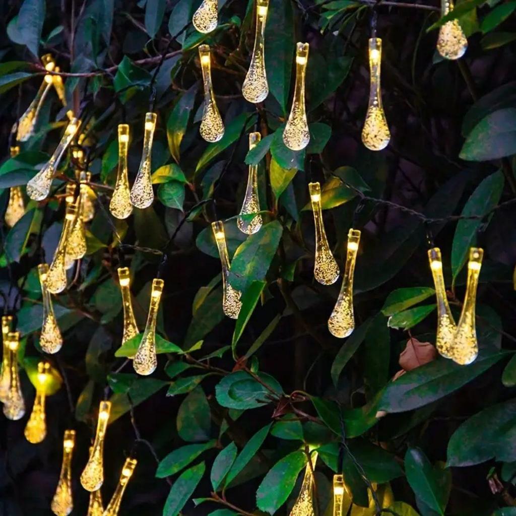 Solar LED Water Drop String Lights: Colorful, Moisture-Proof Decorative Lighting for Festivals, Hotels, and Courtyards with Ground Plug Feature.