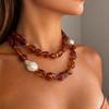 Stylish Red Resin Irregular Bead Necklace With Adjustable Length For Personalized Fit And Artistic Design In Sturdy Alloy Construction.