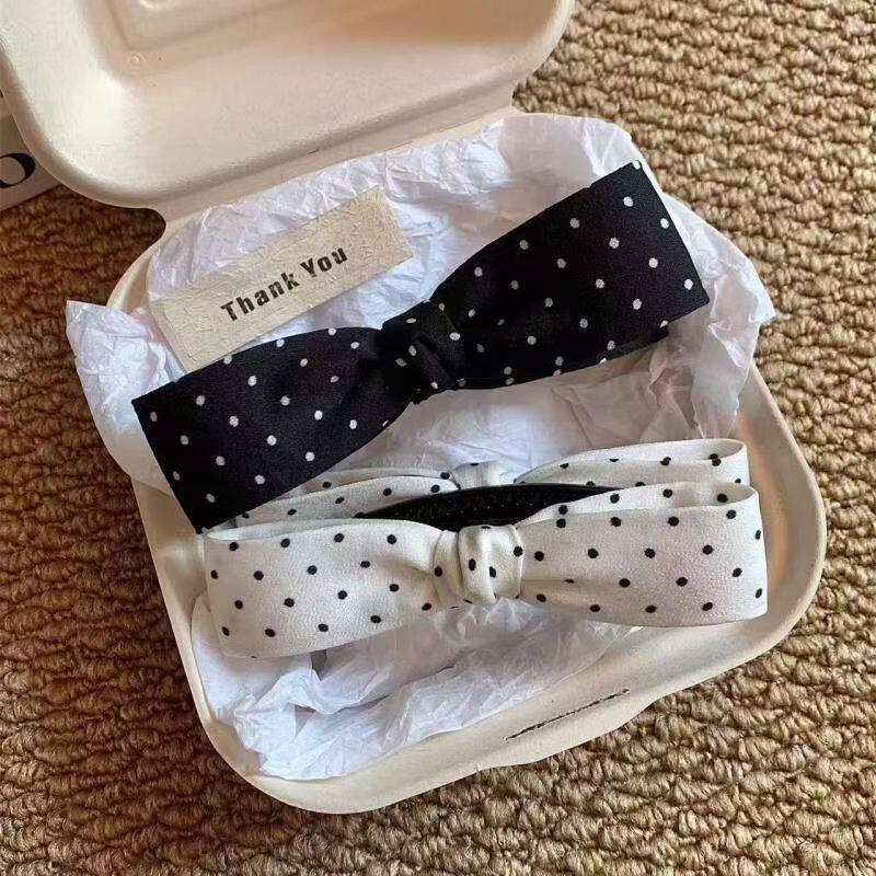 Elegant Black & White Polka Dot Bow Banana Clip: Fashionable Hair Accessory for Women.