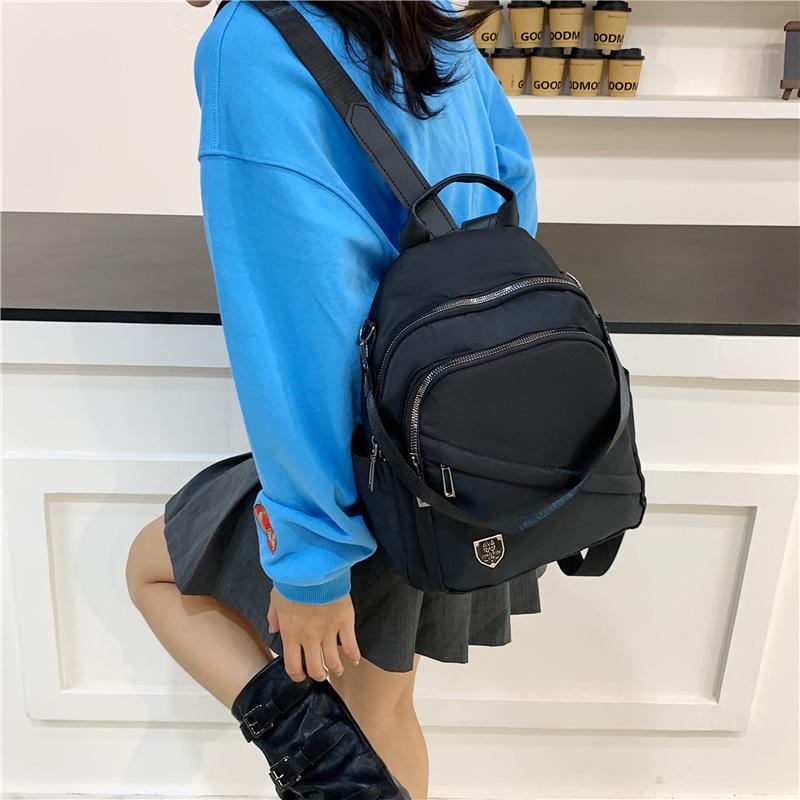Schoolbag Simple temperament Casual backpack Multi-pocket large capacity Lightweight backpack Fashion versatile shoulder messenger bag