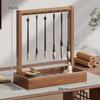 Solid Wood Calligraphy Brush Holder: Desktop Pen Rack with Scholar's Treasures Ornament and Metal Hook Design.