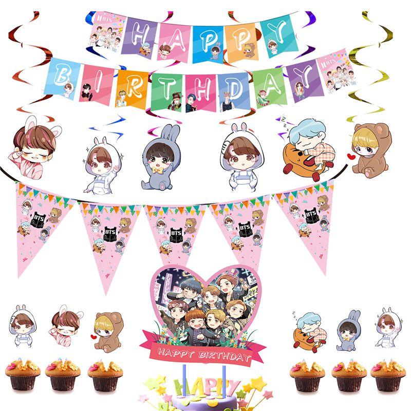 Fournitures de fête d'anniversaire festives sur le thème de BTS avec un cake topper coloré et des cupcake toppers joyeux