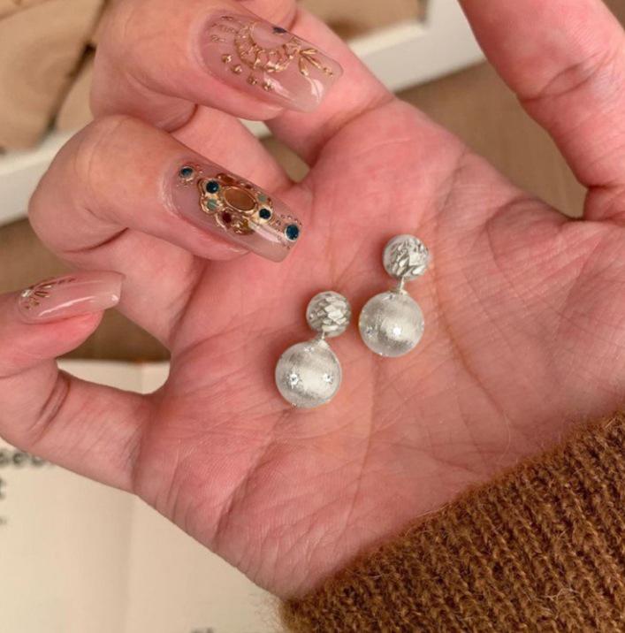 Gold Brushed Starburst Ball Stud Earrings: Versatile, Light Luxury Design for Women.