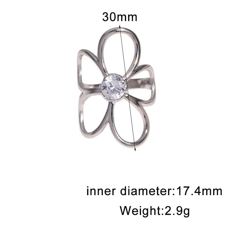 Elegant Diamond Inlaid Hollow Flower Stainless Steel Ring - Simple, Non-Fading, Open Design.