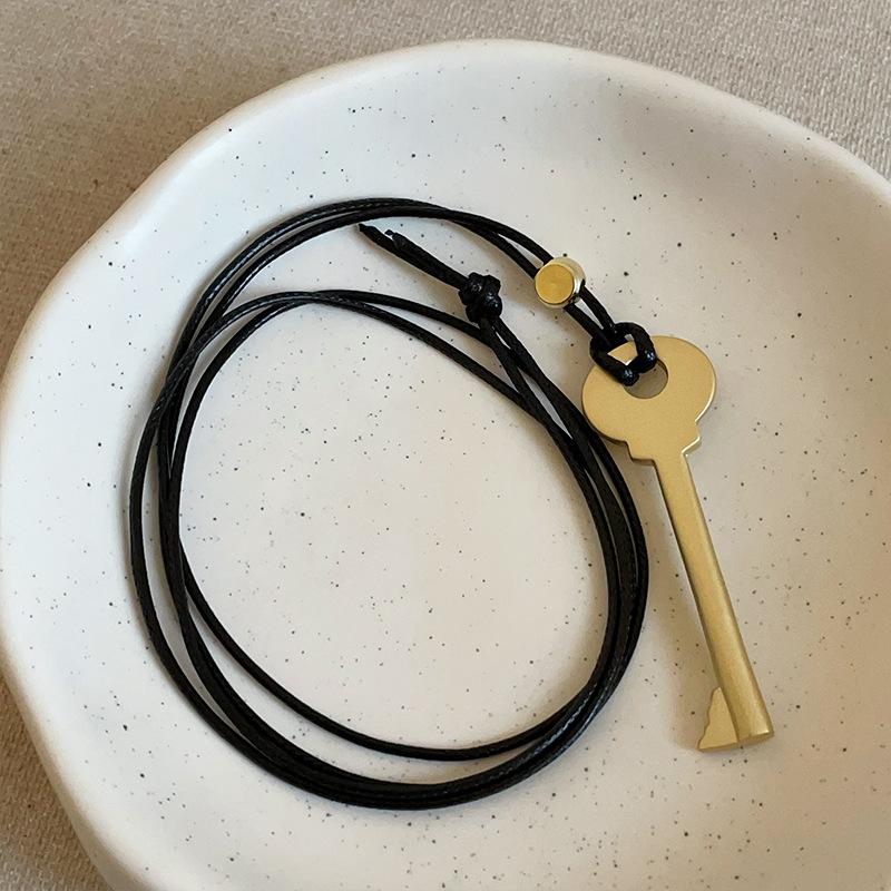 

Creative Matte Color Metal Key Pendant Necklaces for Women Girls Adjustable Long Wax Rope Sweater Chain Chokers Wholesale